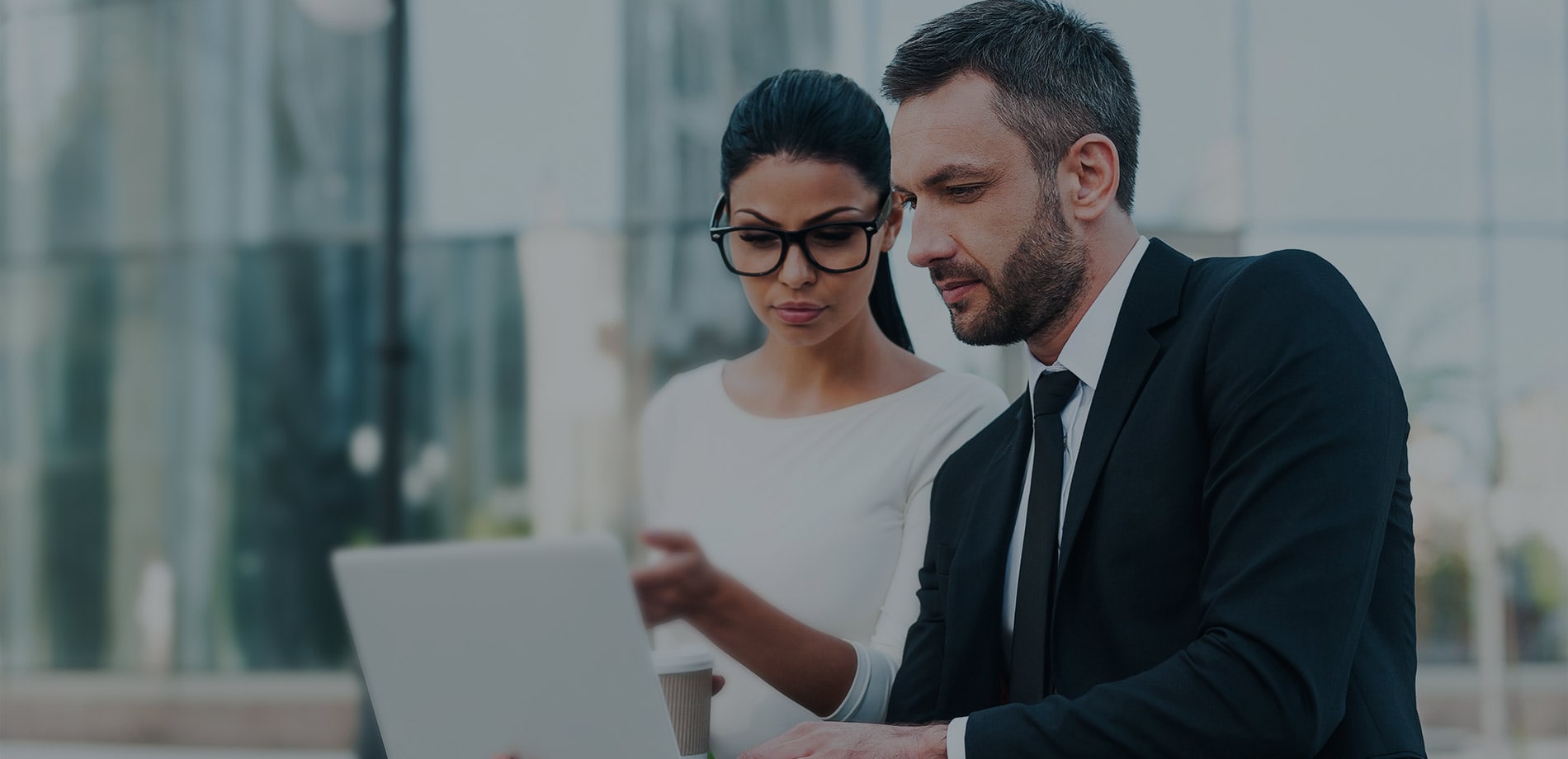 Two professionals reviewing a financial plan